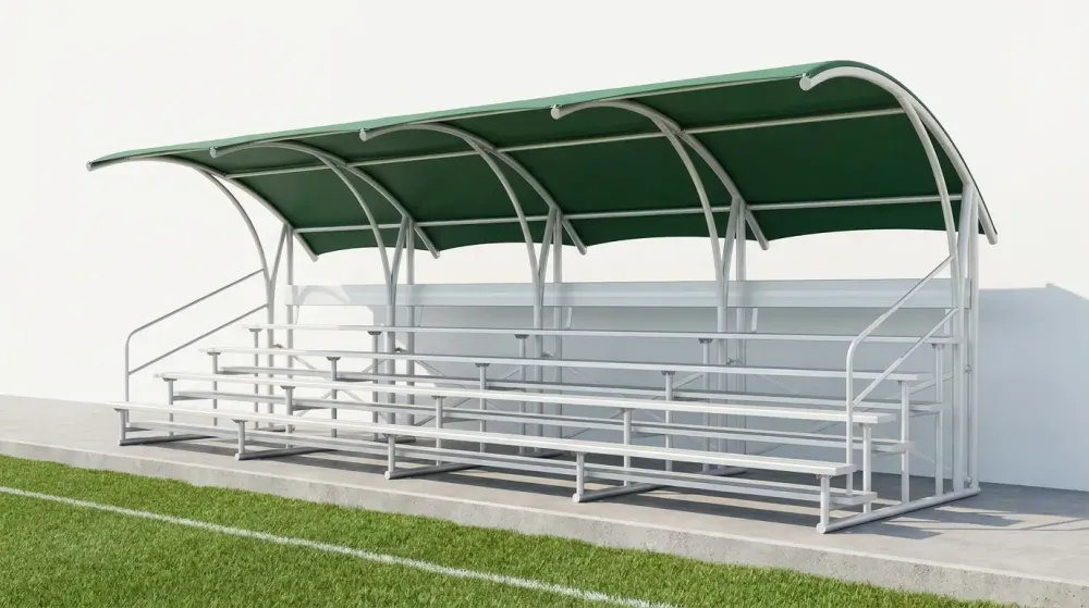 Gradas metálicas con techo de lona verde para cancha deportiva, vista frontal con escalones y barandales
